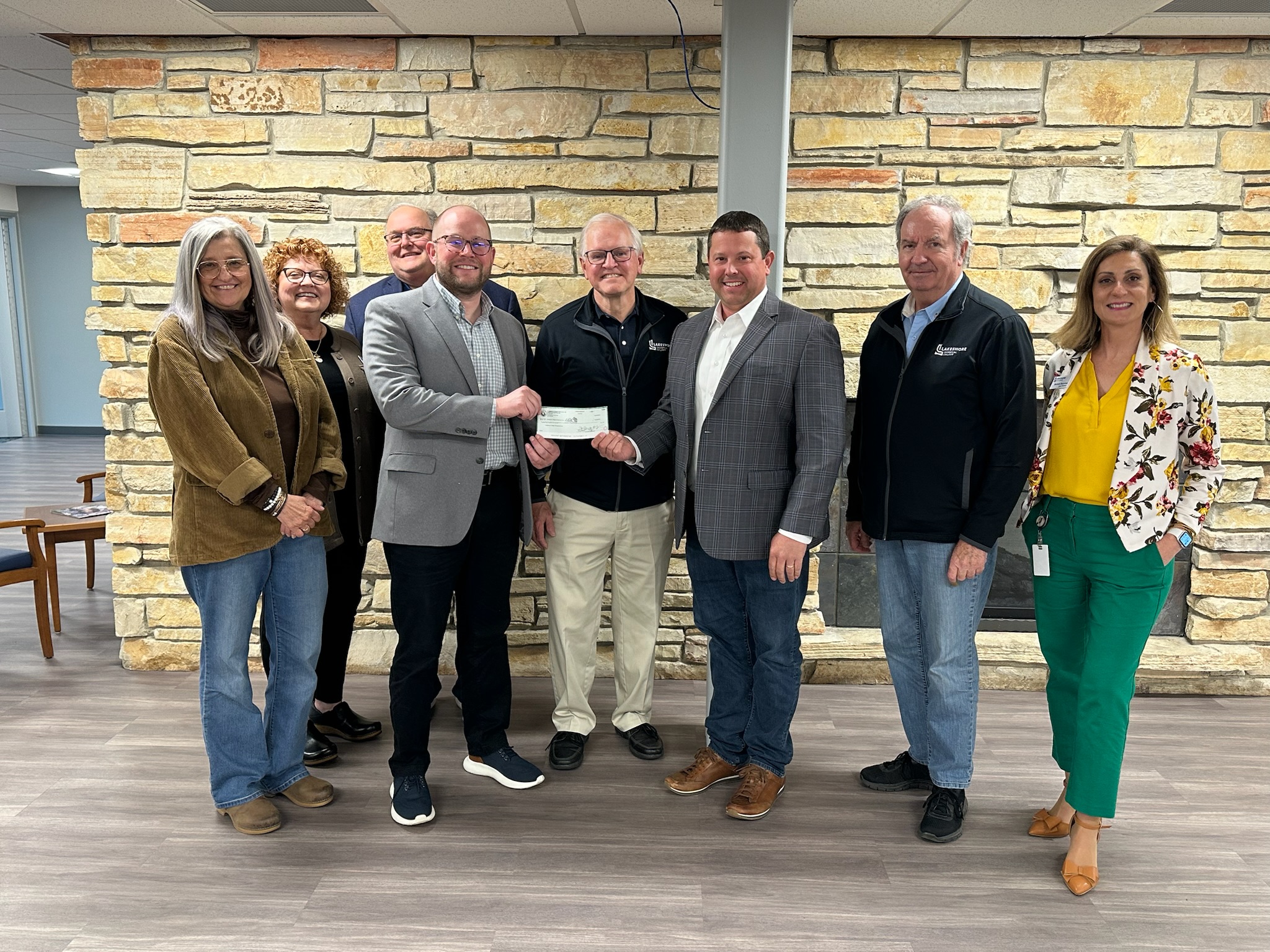 Dustin Delsman presents Lakeshore College President Dr. Paul Carlsen a $25,000 check on behalf of Plumbers & Steamfitters UA Local 400 for the establishment of a scholarship fund.